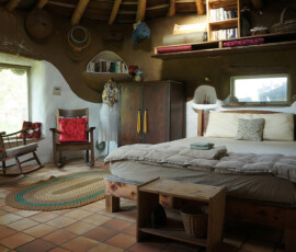 Small cob house with clay and lime interior plaster