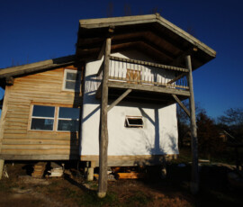 Lime plaster on straw bale home exterior
