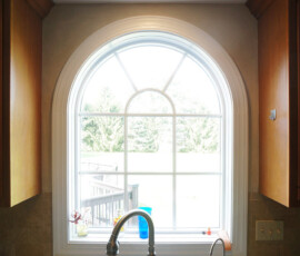 Gypsum plaster detail around arched window